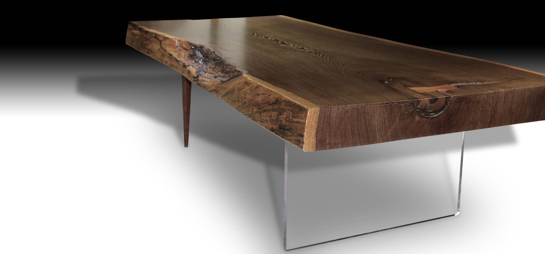 Animal live edge walnut wood coffee table with teak wood pencil legs and glass base