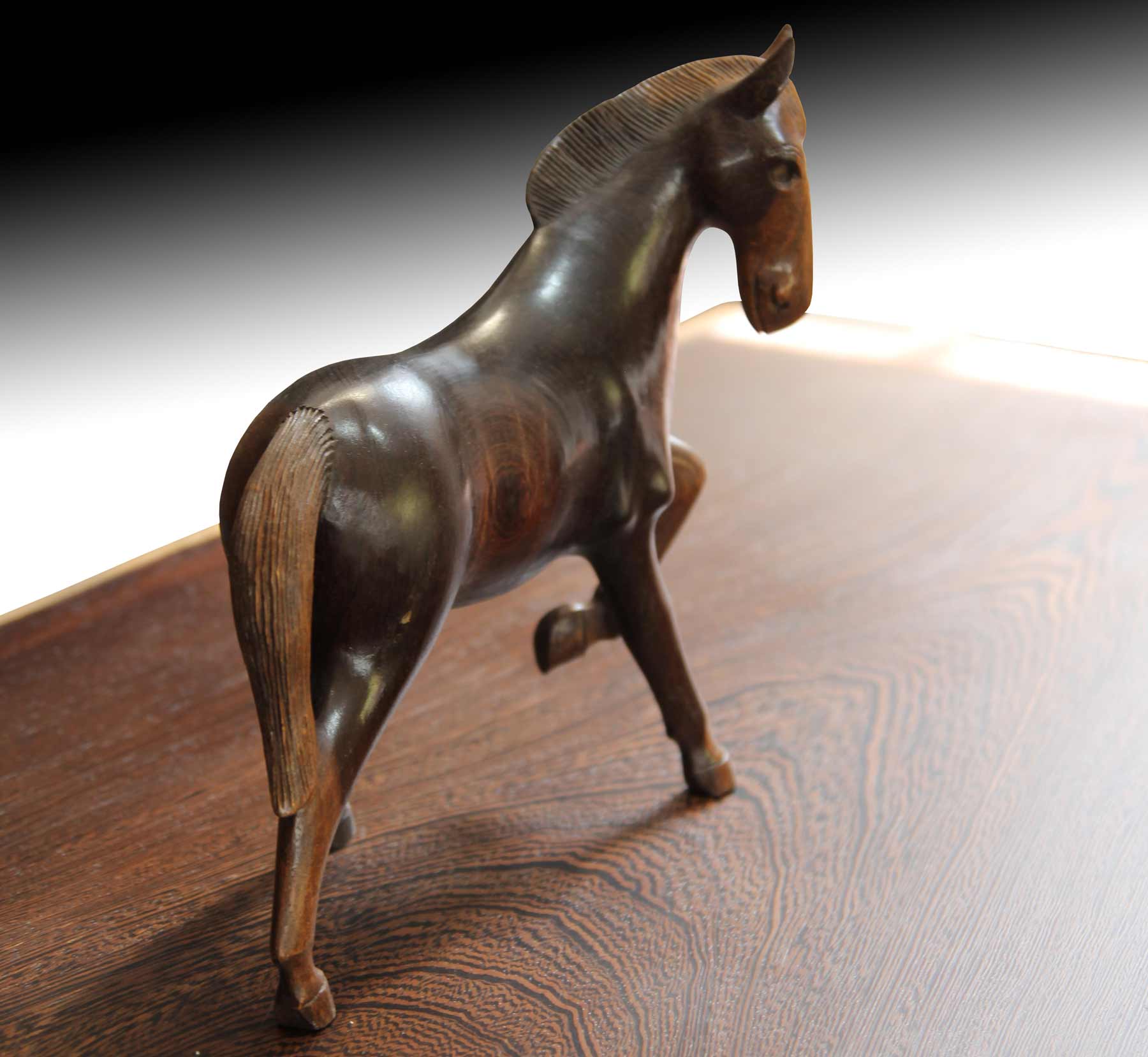 Wooden horse fugurine on live edge Suar wood table