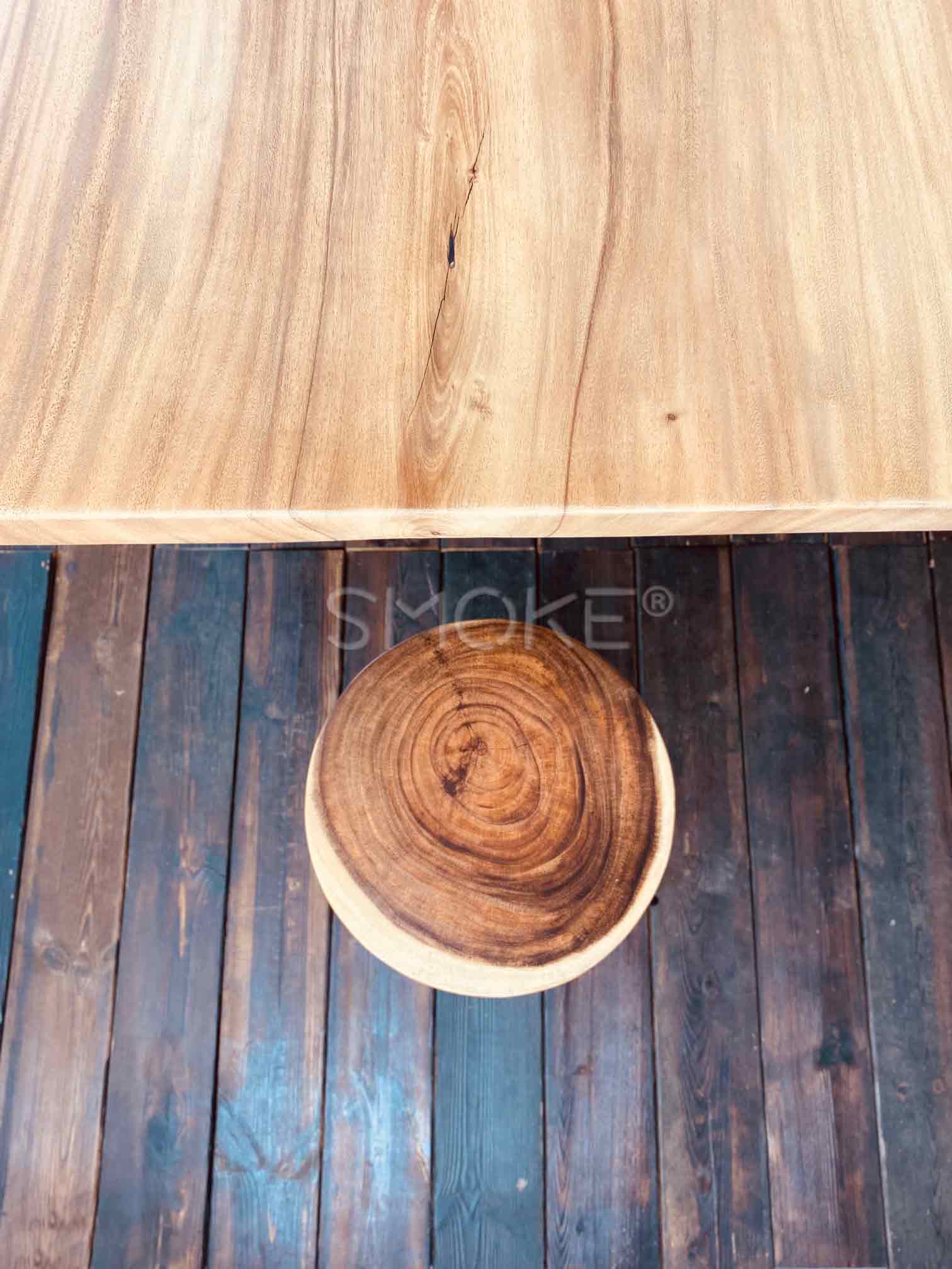 Suar wood stool on panel floor